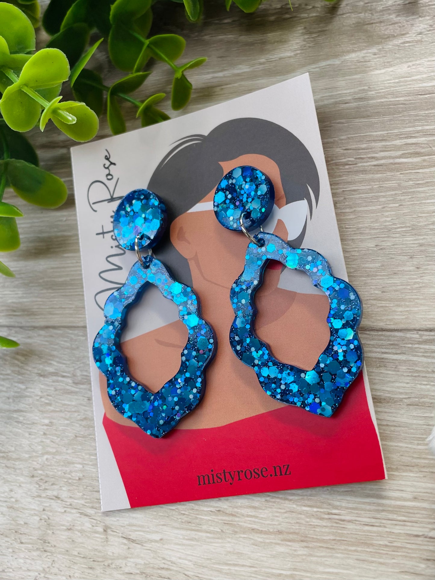 Dark blue glittery frilly teardrop earrings 💫  These fun, lightweight earrings are sure to add some sparkle to any look!  Approx 5cm x 3.5cm with stud topper