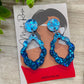 Dark blue glittery frilly teardrop earrings 💫  These fun, lightweight earrings are sure to add some sparkle to any look!  Approx 5cm x 3.5cm with stud topper