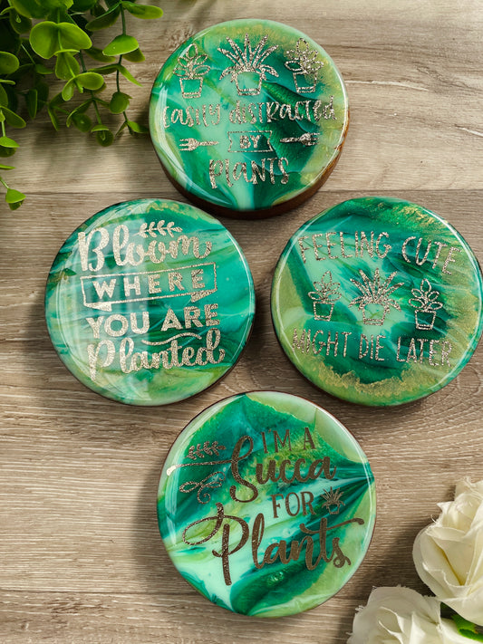 This one is for all the plant nurturers our there 💚💫  A gorgeous set of four green coasters with gold detailing throughout  Great as a housewarming gift or a treat for yourself!  Images/Sayings are:  • Easily distracted by plants  • Feeling cute might die later  • I'm a succa for plants  • Bloom where you are planted