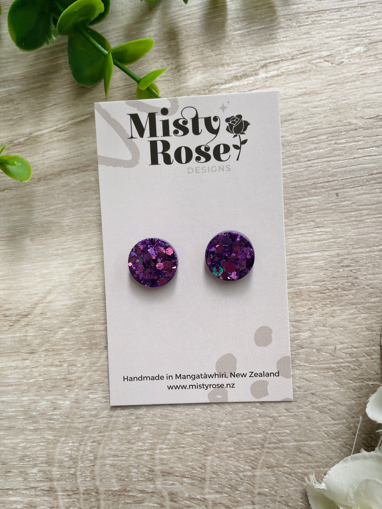 Sparkly circle stud earrings ✨  Mid-purple glitter&nbsp;  These lovely lightweight earrings are sure to add some sparkle to any look!  Approx 1.5cm diameter  Handmade in Waikato, Ne