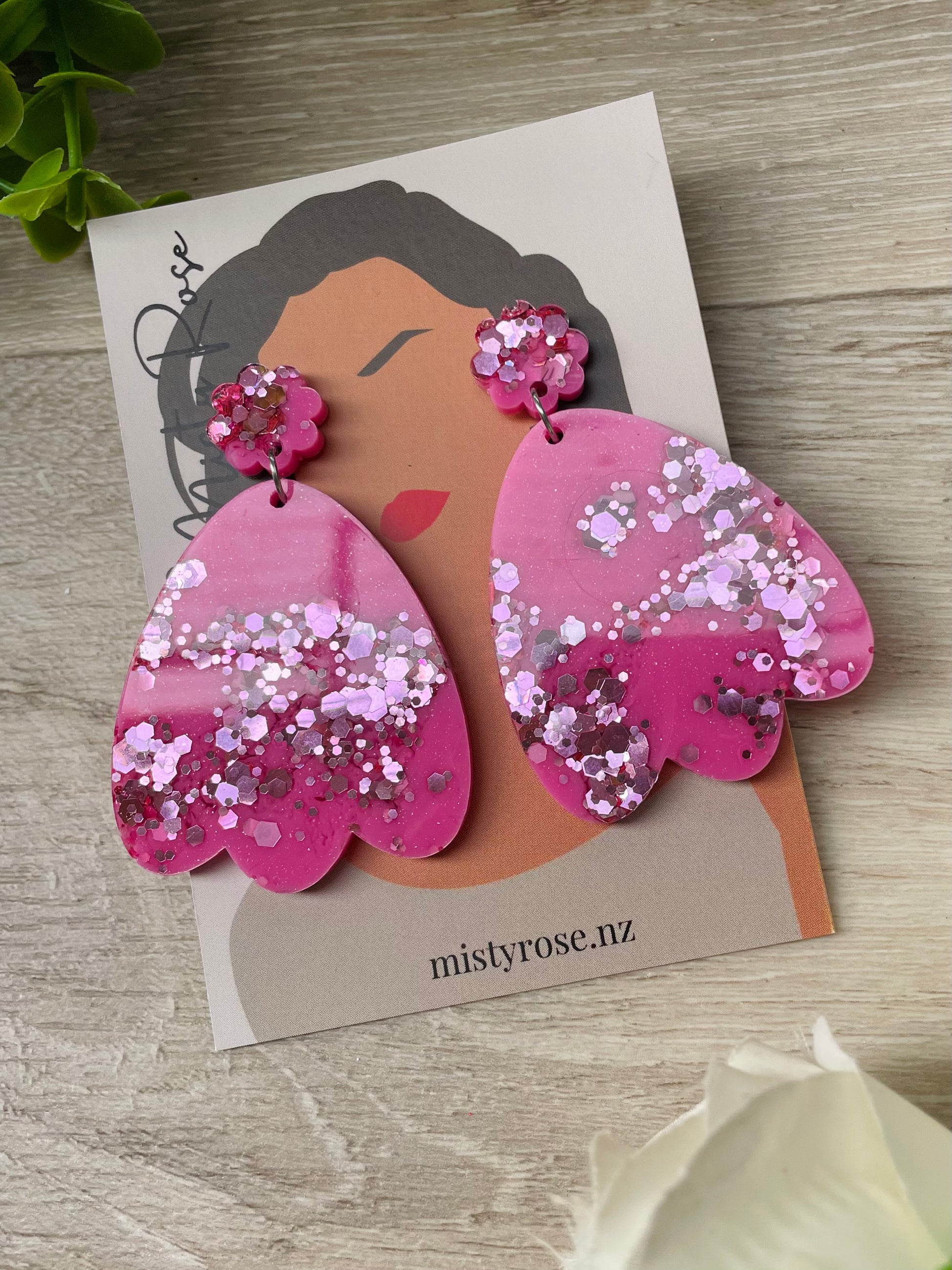 Oversized petal earrings  Rose pink and light pink glitter with a cute flower shaped topper  These bold & glittery lightweight earrings are sure to add some sparkle to any look.  Approx 6.5cm x 4.5cm with stud topper